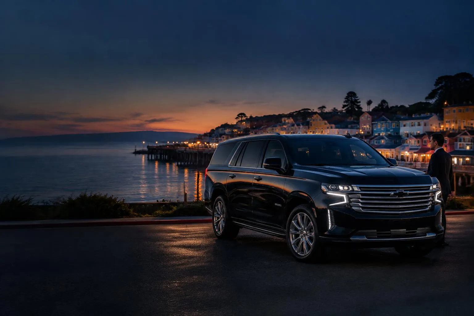 Capitola arrival scene with a private black chauffeur vehicle prepared for a scheduled transfer